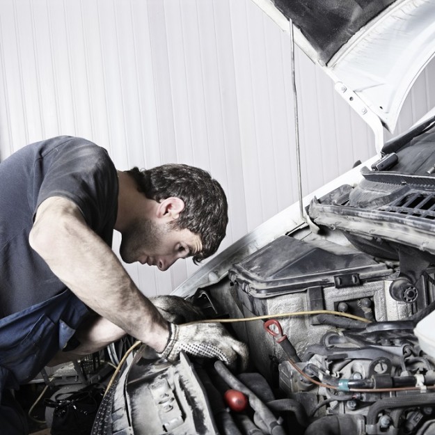 auto mechanic repairing a car engine